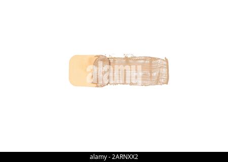 Close-up of makeup sponge with sample of liquid fluid make-up foundation isolated on white background - top view Stock Photo