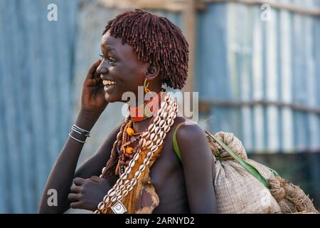 Happy young Hamer woman in Dimeka village, Omo river valley, Ethiopia. Stock Photo