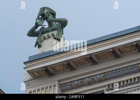 Vienna, Austria - June 6, 2019; Female sculpture crying out made by Othmar Schimkowitz on top of the Wagner’s house of muses designed by Otto Wagner i Stock Photo