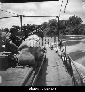 [View from a patrol boat on another boat on a river] Date: 1947/01/01 Location: Indonesia, Dutch East Indies Stock Photo