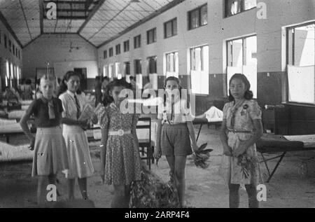 Young girls, some in scouting/Boy Scout uniform, in an infirmary Date: 1947/01/01 Location: Indonesia, Dutch East Indies Stock Photo