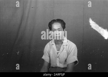 Portrait photos (miscellaneous) [passport photos]  Young Indonesian man in citizen Date: 1947 Location: Indonesia, Dutch East Indies Stock Photo