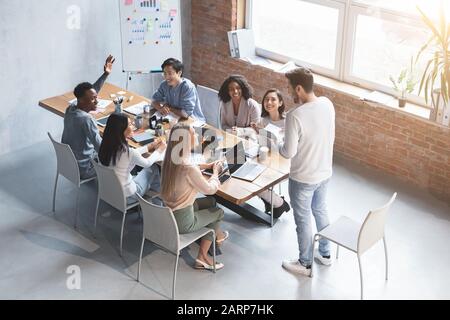 Multiethnic group of employees having business meeting discussion Stock Photo