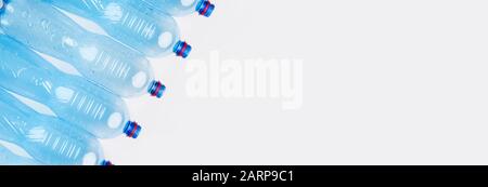 Pattern of Plastic bottles with water on white background Stock Photo