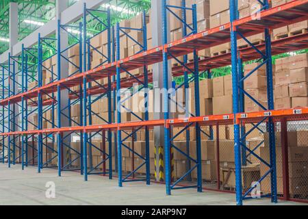 Space of shelves in the warehouse, interior of warehouse. Stock Photo