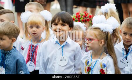 Holiday 1 September. First school bell. Elegant excited first-graders Lutsk, Ukraine 01.09.19 Stock Photo