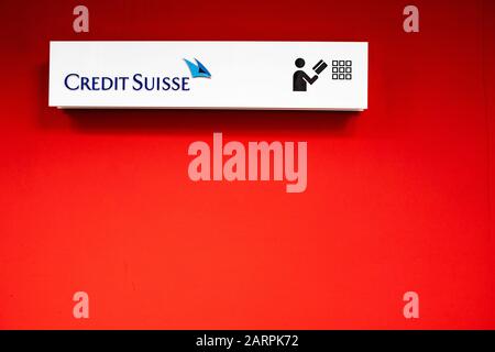 BERN, SWITZERLAND - JANUARY 2020: Credit Suisse sign on red wall Stock Photo