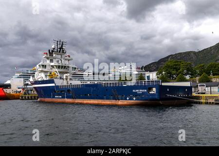 Offshore PSV fire fighting, stand-by vessel Island Dragon in the port of Bergen, Norway. Stock Photo