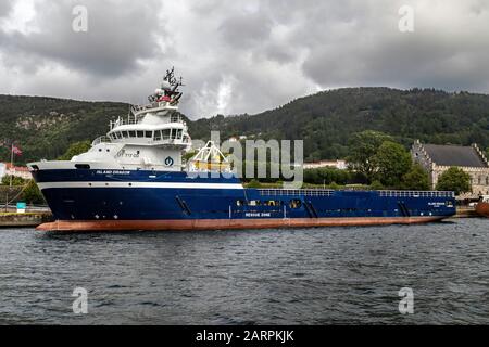 Offshore PSV fire fighting, stand-by vessel Island Dragon in the port of Bergen, Norway. Stock Photo