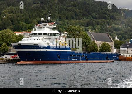 Offshore PSV fire fighting, stand-by vessel Island Dragon in the port of Bergen, Norway. Stock Photo