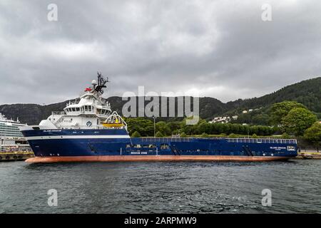 Offshore PSV fire fighting, stand-by vessel Island Dragon in the port of Bergen, Norway. Stock Photo