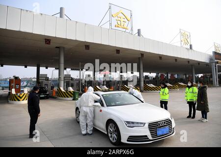 Hefei, China's Anhui Province. 29th Jan, 2020. Staff members measure temperatures of passengers at an expressway exit in Hefei, east China's Anhui Province, Jan. 29, 2020. Various measures are taken across China to combat the novel coronavirus. Credit: Liu Junxi/Xinhua/Alamy Live News Stock Photo