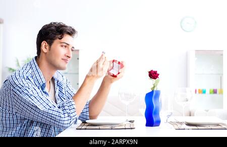 Man alone preparing for romantic date with his sweetheart Stock Photo