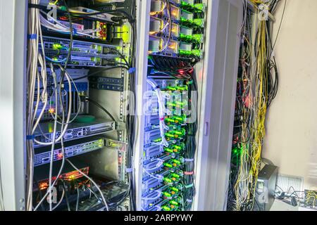 Computer equipment with a large load are located in the server room datacenter. Many racks with servers are in the data center Stock Photo