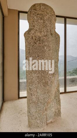 Menhir statue, Neolithic era, 2500-2000 BC, displayed at street pavillion in hill town of Pieve, Nebbio region, Haute-Corse, Corsica, France Stock Photo