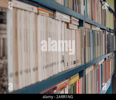 used books displayed on a metal shelving Stock Photo