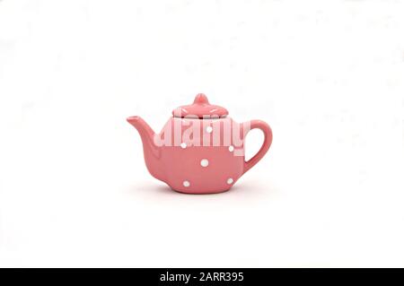 pink polka dot porcelain teapot isolated on white background Stock Photo