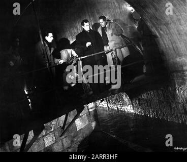 Assistant Director GUY HAMILTON ORSON WELLES as Harry Lime and Director CAROL REED on set candid filming sewer sequence for THE THIRD MAN 1949 screenplay GRAHAM GREENE producer ALEXANDER KORDA London Film Productions / British Lion Film Corporation Stock Photo