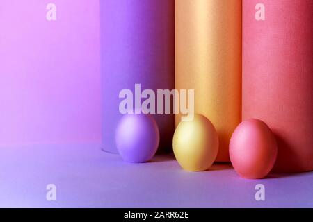 Colored Easter eggs with tubes made from craft paper. Ester concept. Stock Photo