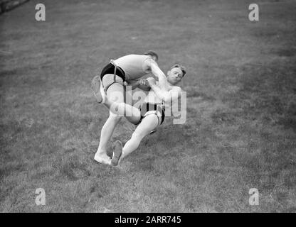 Iceland  Reykjavik. Icelandic wrestling (Glima). Two members of the glimateam of the Menntaskolinn in action Date: 1934 Location: Iceland, Reykjavik Keywords: sports clubs, martial and defensive sports, wrestling Stock Photo