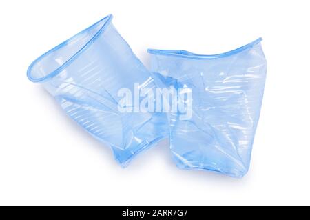 Overhead studio shot of a pair of crushed plastic disposable cups cut out on a white background - John Gollop Stock Photo