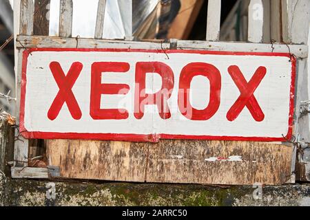 Ibajay, Aklan Province, Philippines: Hand-painted Xerox signage on plywood, informing the people that a copy machine is available Stock Photo