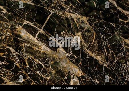 Gold and white Patterned natural of dark gray marble texture background for product design. Black marble natural pattern for background. Stock Photo