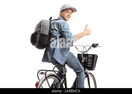 Guy riding a bicycle and holding his thumb up isolated on white background Stock Photo