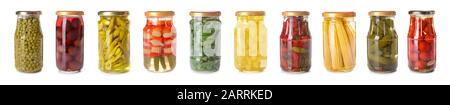 Jars with different canned vegetables on white background Stock Photo