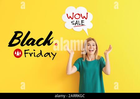 Happy woman with speech bubble and text BLACK FRIDAY on color background Stock Photo