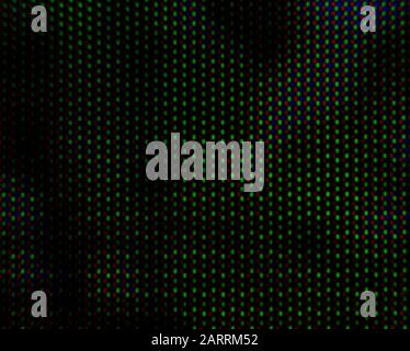 abstract background pattern of colored blurry dots on a dark background close up Stock Photo