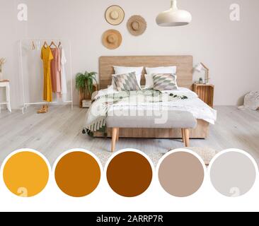Stylish interior of comfortable bedroom. Different color patterns Stock Photo