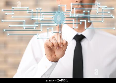 Businessman scanning finger print for enter security system. Concept of data protection Stock Photo