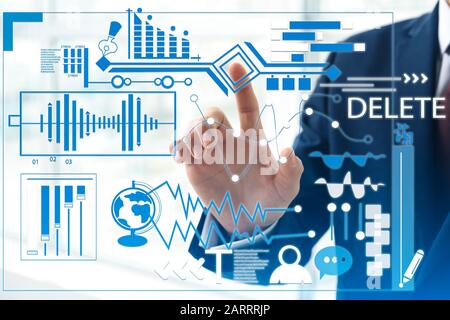 Businessman using virtual screen in office. Concept of modern business technologies Stock Photo