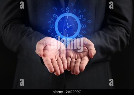 Businessman with drawn clock against dark background, closeup Stock Photo