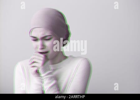 Desperate woman after chemotherapy on light background Stock Photo