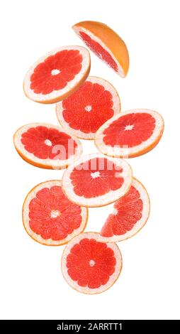Flying cut grapefruit on white background Stock Photo