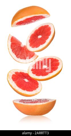 Flying cut grapefruit on white background Stock Photo