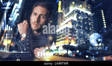 Multiple exposure of handsome businessman, diagrams and night city Stock Photo