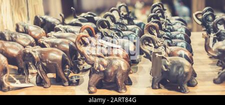 carved wooden small elephant sculpture decors in a shop at Pinnawala Sri Lanka Stock Photo