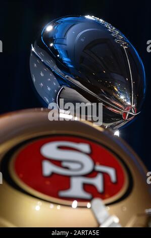 Miami, USA. 29th Jan, 2020. Team helmets for the San Francisco 49ers and the Kansas City Chiefs are on display along with the Vince Lombardi Trophy ahead of NFL Commissioner Roger Goodell's Super Bowl LIV press conference held at the Hilton Downtown in Miami, Florida on Jan. 29, 2020. (Photo by Anthony Behar/Sipa USA) Credit: Sipa USA/Alamy Live News Stock Photo