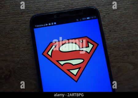 Superman logo displayed on a modern smartphone