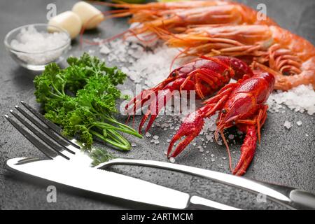 Tasty crayfish with shrimps on dark background Stock Photo