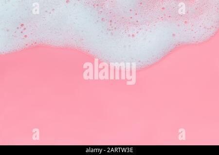 Pink foam bubbles on pink background Stock Photo