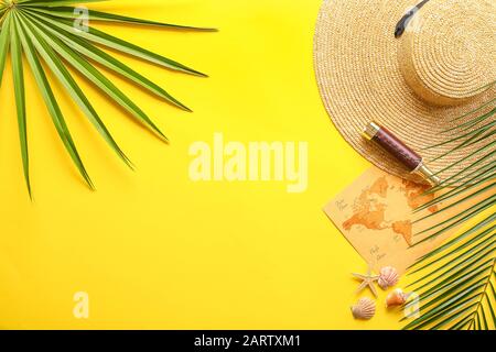 World map with spyglass Stock Photo - Summer Composition With Hat World Map Spyglass And Palm Leaves On Color Background 2artxm1 