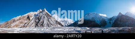 Panoramic view of K2, the second highest mountain in the world with surrounding mountains such as Crystal Peak, Marble Peak, Angel peak, Nera peak and Stock Photo