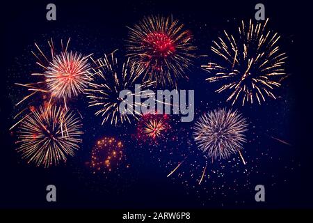 Abstract color fireworks display on dark sky background Stock Photo