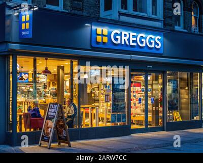 Greggs Bakery - Greggs Cafe and Food Store at dusk Stock Photo