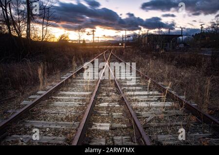 Moody scenic of railroad tracks (railroad switch) at sunset in Penrose (near Brevard), North Carolina, USA Stock Photo