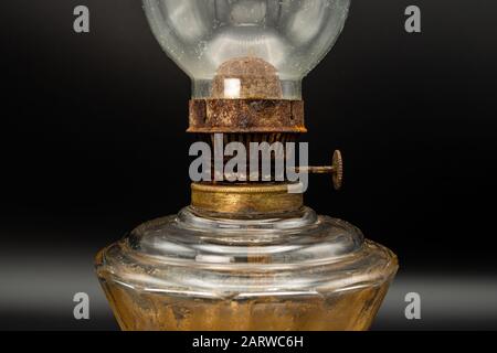 Detail of an old rusty kerosene lamp, black background Stock Photo